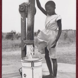 Boy in Zimbabwe fetching water