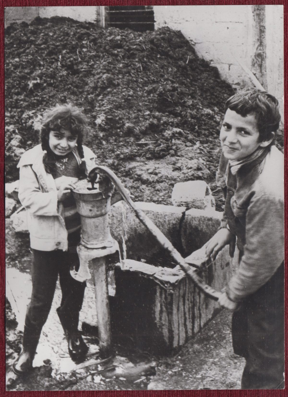 Turkish Children Drinking Water From a Pump