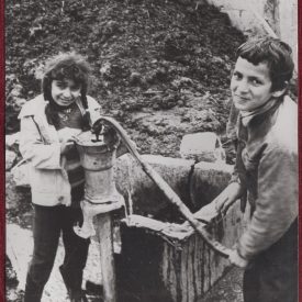 Turkish Children Drinking Water From a Pump