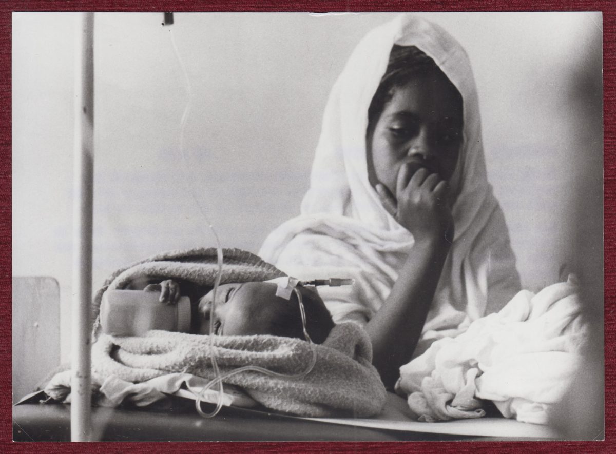 Press photo of a mother and her sick child