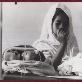 Press photo of a mother and her sick child