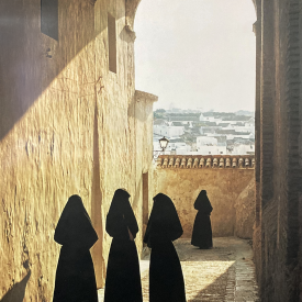 Travel poster featuring women wearing cobijadas in Cadiz, Spain